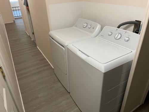 A laundry room with a washer and dryer in it.